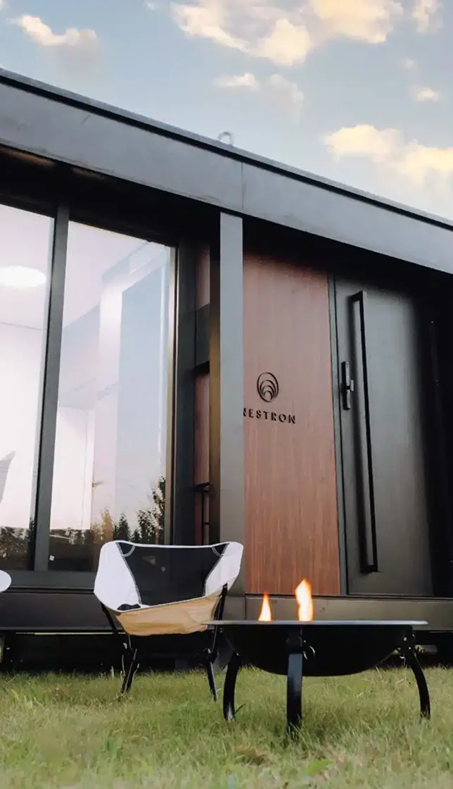 Nestron modular home exterior with wood door detail, choose your model step