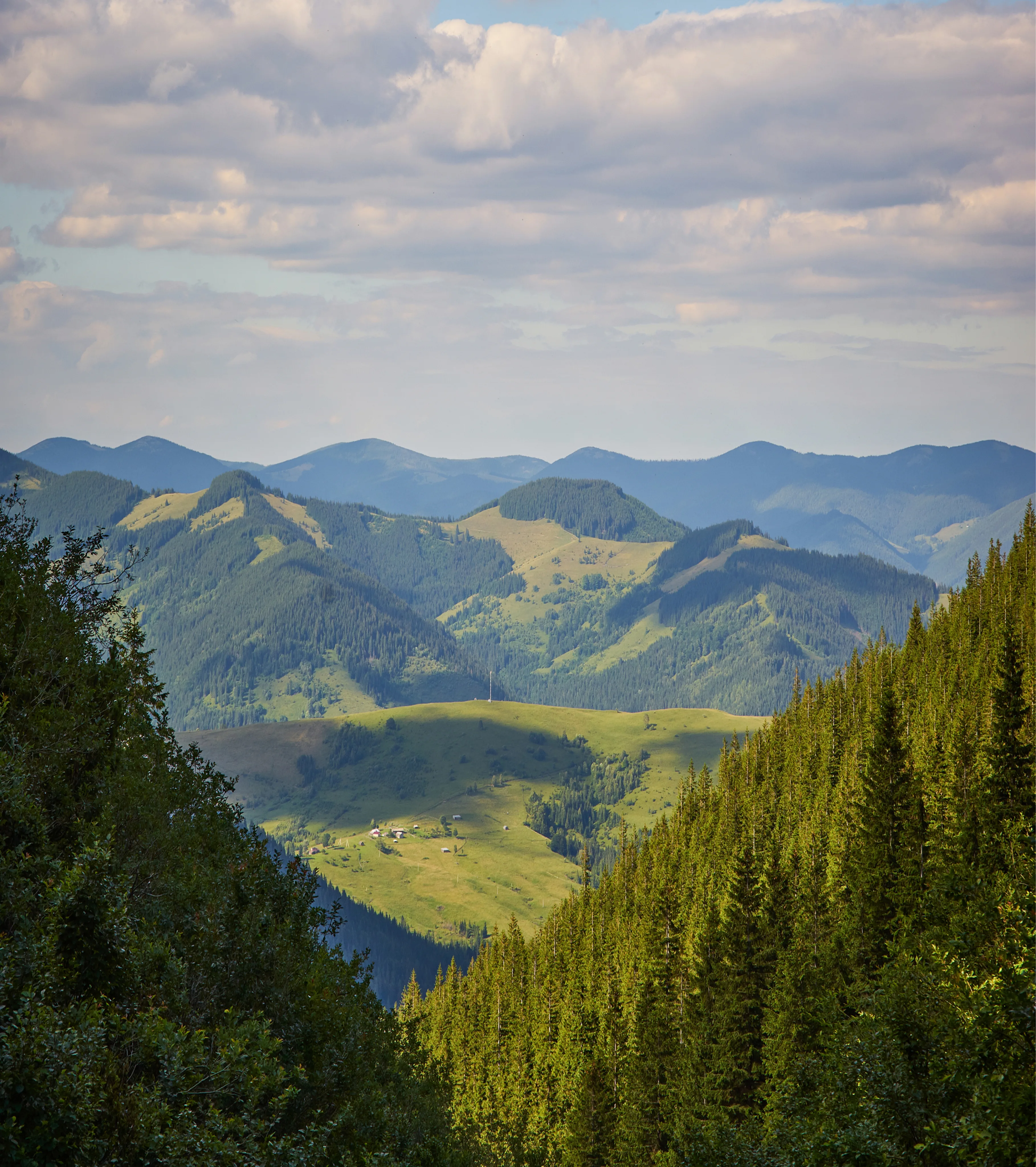 Mountain landscape with green valleys and distant peaks