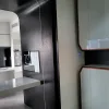 Nestron Cube Two X bathroom interior with mirror and dark cabinetry