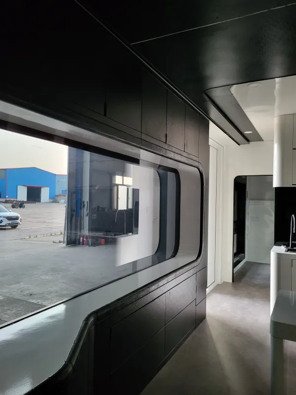 Nestron Cube Two X interior with dark paneling and window view