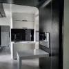 Nestron Cube Two X kitchen interior with dark cabinetry