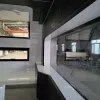 Nestron Cube Two X interior with a large glass window wall, built-in counter, and small side windows