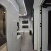 Nestron Cube Two X interior hallway view with an open door leading to a table and window
