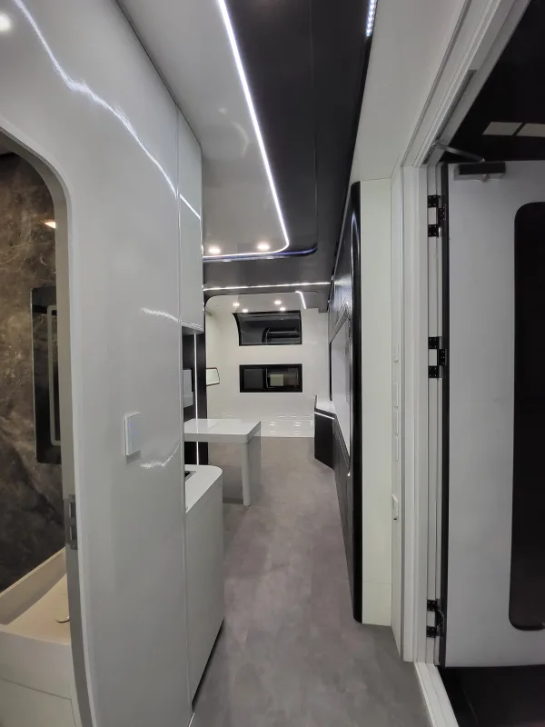 Nestron Cube Two X interior hallway view with an open door leading to a table and window