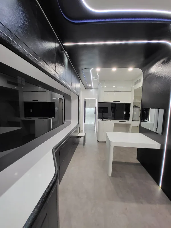 Nestron Cube Two X interior rendering with a long panoramic window, white table, and dark cabinetry