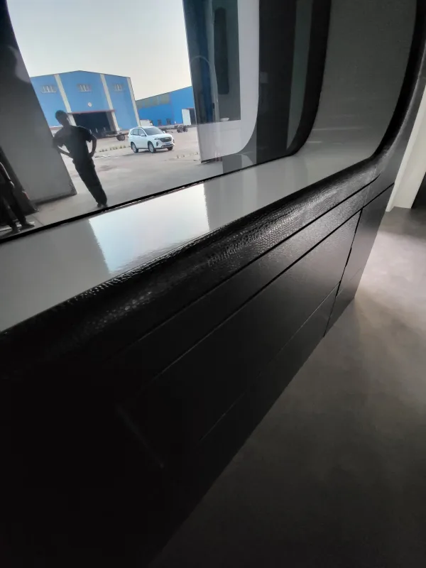 Close-up interior rendering of the Nestron Cube Two X panoramic window and dark countertop