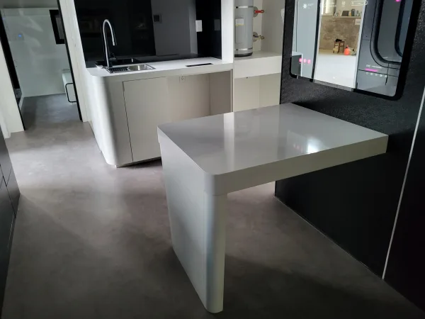 Nestron Cube Two X interior rendering with a dining table, seating, and kitchen area