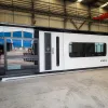 Front exterior rendering of the Nestron Cube Two X at a factory with a white entry door and large dark tinted window