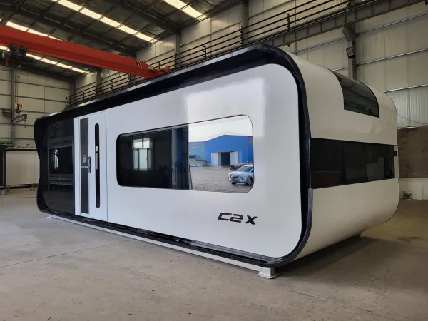 Front exterior rendering of the Nestron Cube Two X with a large reflective window and dark trim