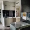 Nestron Cube Two X kitchen rendering with light cabinetry, built-in appliances, and a compact dining area