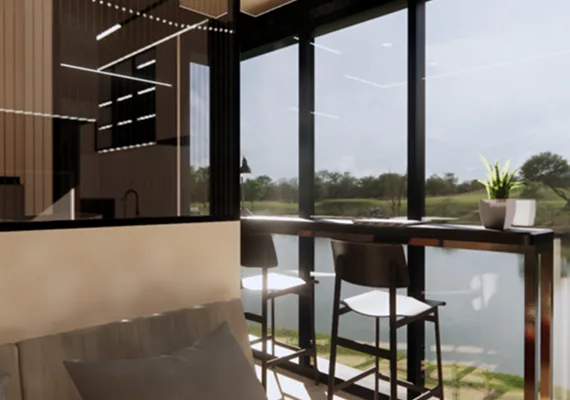 Modern modular home interior with floor-to-ceiling windows and a dining counter