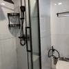 Nestron Legend One bathroom rendering with a glass shower enclosure, black shower fixtures, and a white toilet