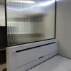 Nestron Legend One interior rendering with a large mirrored wall panel, white built-in drawers, and dark trim
