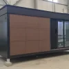 Angled exterior rendering of the Nestron Legend One with brown facade panels and dark trim