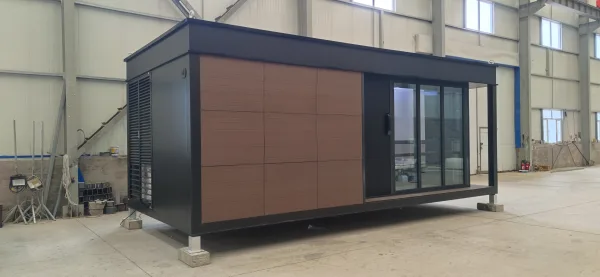 Angled exterior rendering of the Nestron Legend One with brown facade panels and dark trim