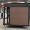 Rear exterior rendering of the Nestron Legend One with brown facade panels and dark structural trim