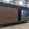 Side exterior rendering of the Nestron Legend One with brown facade panels and a large dark framed window