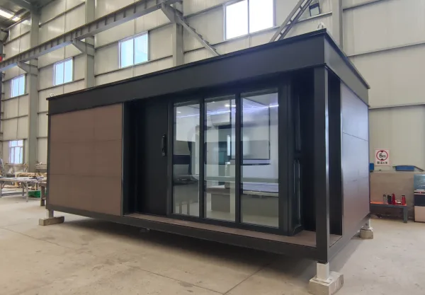 Exterior rendering of the Nestron Legend One with large glass doors, dark trim, and wood facade panels