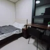 Nestron Legend Two bedroom rendering with a bed, desk, chair, and large window