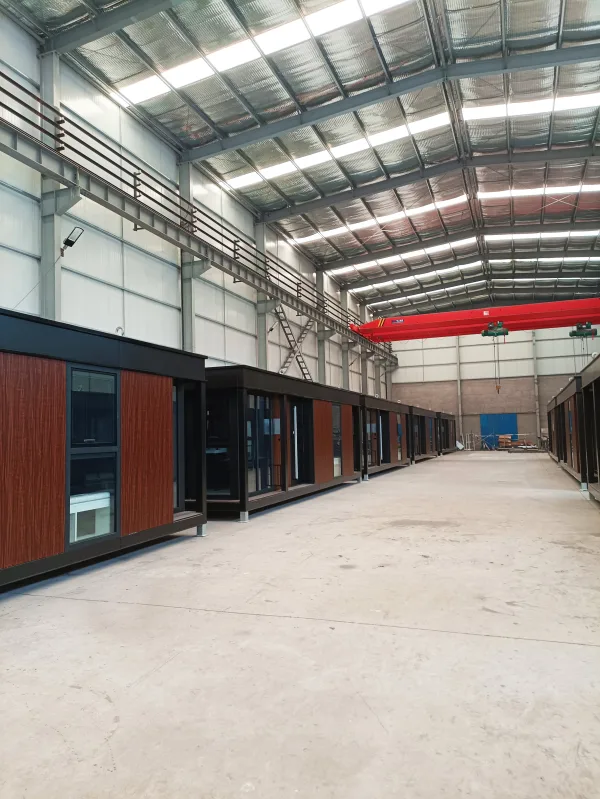 Nestron Legend Two exterior view inside a factory showing multiple modular units lined along the production floor