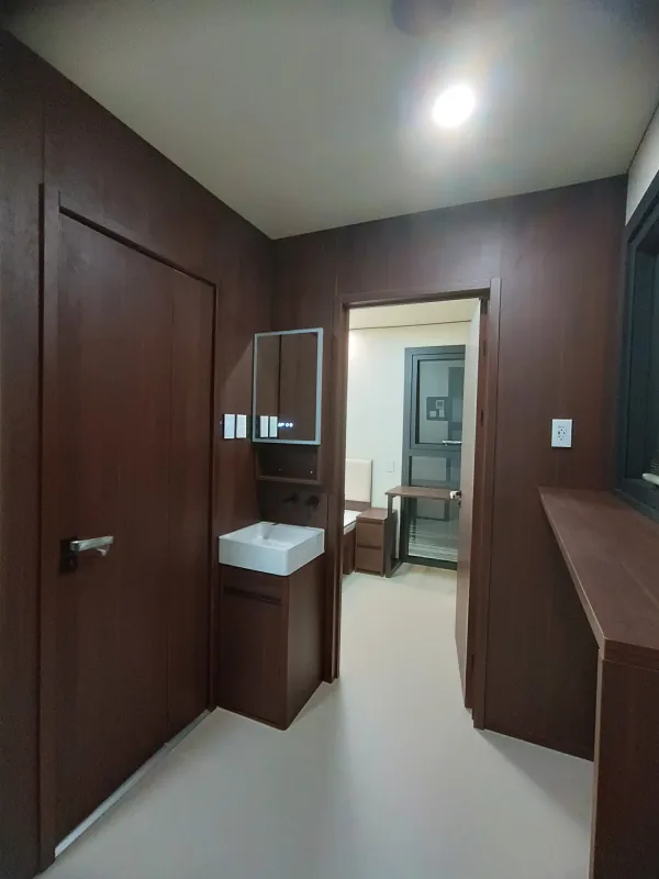 Nestron Legend Two interior rendering showing a hallway with dark wood cabinetry, mirrors, and recessed lighting
