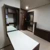 Nestron Legend Two interior rendering with a white dining table, dark wood cabinetry, and kitchen area
