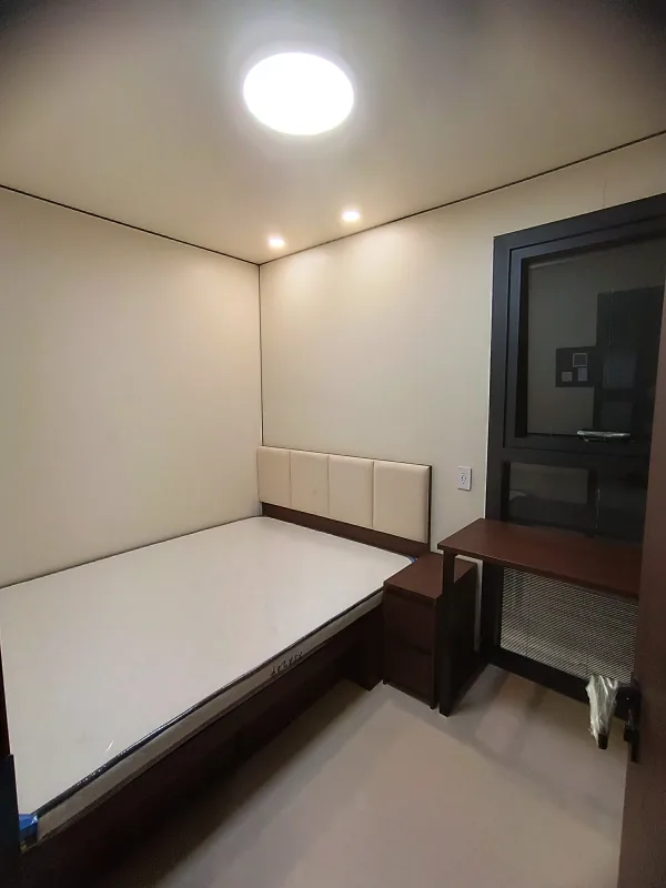 Nestron Legend Two interior rendering showing a bright room with white walls, recessed ceiling lights, and dark trim