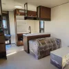 Nestron Legend Two kitchen rendering with wood cabinetry, white countertops, sink, and built-in appliances