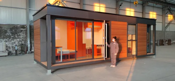 Nestron Legend Two exterior rendering with large glass doors, warm interior lighting, and people standing outside