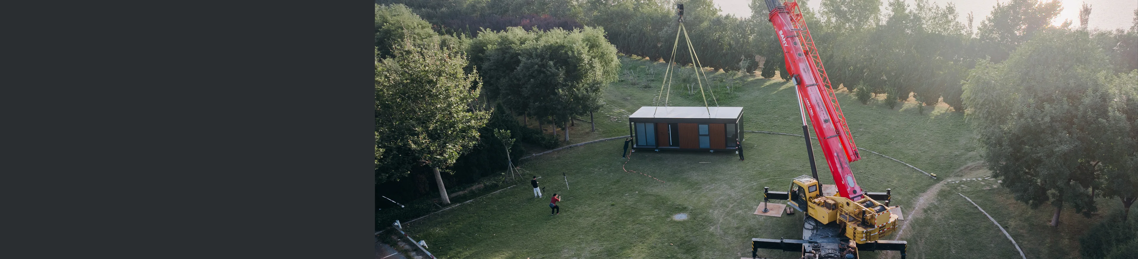 Elevated view of a modular home in a grassy wooded setting