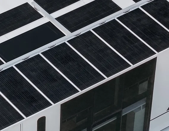 Close-up of rooftop solar panels on a modern modular home