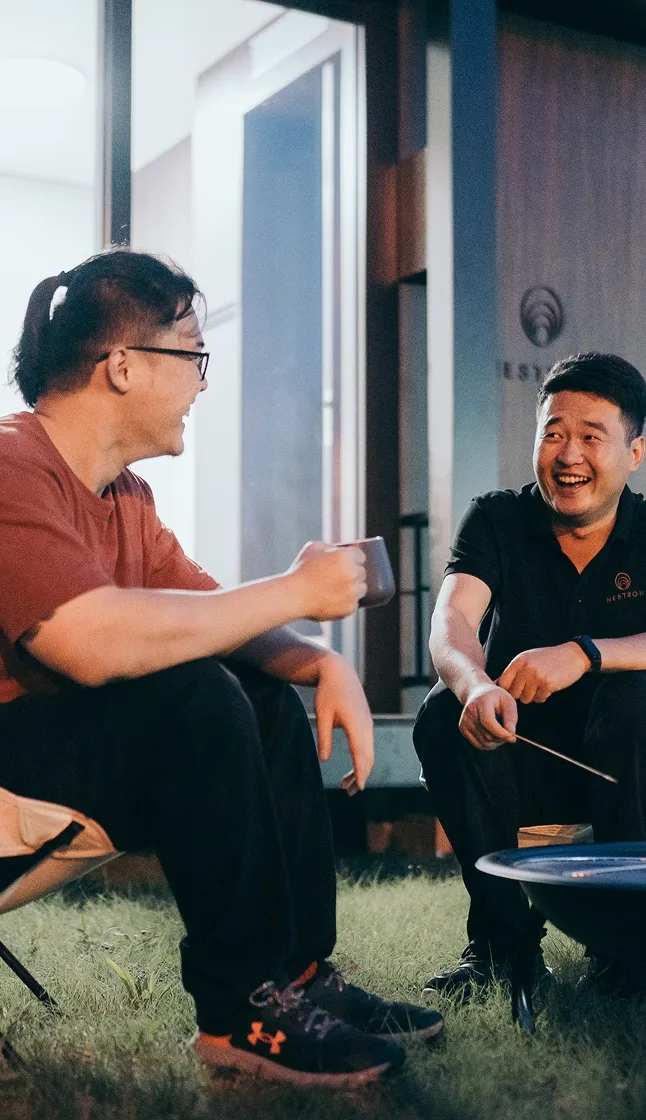 Two people seated together having a conversation or consultation