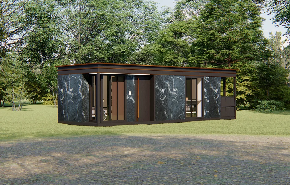 Exterior view of a modern modular home with dark wood siding, large windows, and surrounding greenery